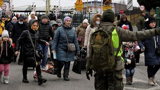 People coming from Ukraine, cross the Polish border in Korczowa.(REUTERS)