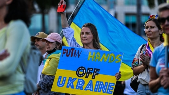 Members and supporters of the Ukrainian community gather to rally in support of Ukraine in Miami, Florida.&nbsp;