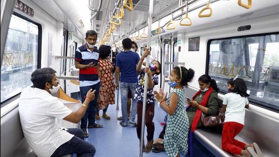 Puneites boarded their first Metro ride at 3:22 pm, minutes after Prime Minister Narendra Modi inaugurated the facility, and hope for hassle-free public transport. (RAHUL RAUT/HT)