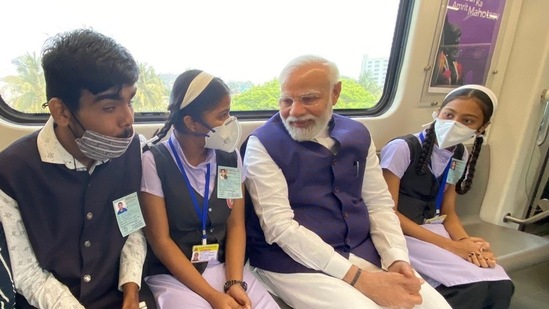 Prime Minister Narendra Modi interacting with school kids in Pune Metro. Prime Minister Narendra Modi interacting with school kids in Pune Metro.