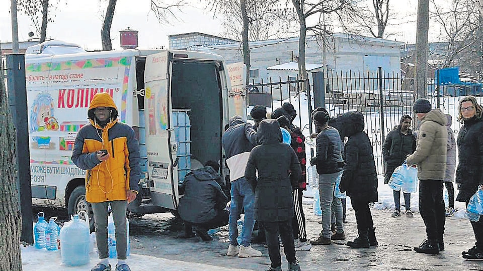 Indian students stranded in Ukraine receive humanitarian assistance from Red Cross Ukraine in coordination with the Indian World Forum, in Sumy on Sunday. (ANI)