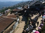 Voters stand in a queue to cast their votes in Ukhrul town, in Manipur, Saturday, March 5, 2022. (AP Photo/Yirmiyan Arthur)(AP) Voters stand in a queue to cast their votes in Ukhrul town, in Manipur, Saturday, March 5, 2022. (AP Photo/Yirmiyan Arthur)(AP)