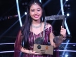 Neelanjana Ray bags the winner's trophy at Sa Re Ga Ma Pa.