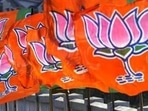 A Bharatiya Janta Party worker erecting BJP flags.(Nitin Kanotra / Hindustan Times) A Bharatiya Janta Party worker erecting BJP flags.(Nitin Kanotra / Hindustan Times)