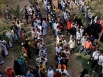 UP election: People stand in a queue to cast their vote at a polling station during the last phase of Uttar Pradesh assembly election in Varanasi. (REUTERS)(HT_PRINT) UP election: People stand in a queue to cast their vote at a polling station during the last phase of Uttar Pradesh assembly election in Varanasi. (REUTERS)(HT_PRINT)
