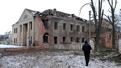 A man walks in front of a building damaged by recent shelling during Ukraine-Russia conflict in Kharkiv, Ukraine. (REUTERS)