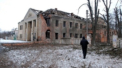 A man walks in front of a building damaged by recent shelling during Ukraine-Russia conflict in Kharkiv, Ukraine. (REUTERS)