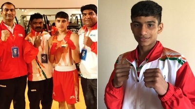 Vishwanath Suresh with his coaches and Raman.&nbsp; (AIBA)