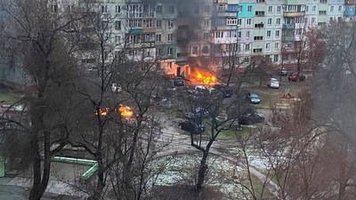 Fire is seen in Mariupol at a residential area after shelling amid Russia's invasion of Ukraine.