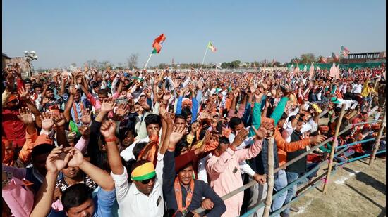 Kushinagar, Feb 28 (ANI): BJP supporters during a Union Home Minister Amit Shah's public rally for the Uttar Pradesh assembly elections, in Kushinagar on Monday. (ANI Photo) (ANI)