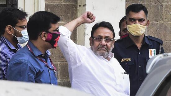 NCP leader and Maharashtra minister Nawab Malik being taken to court from the ED office in Mumbai on Monday. (PTI PHOTO.) NCP leader and Maharashtra minister Nawab Malik being taken to court from the ED office in Mumbai on Monday. (PTI PHOTO.)
