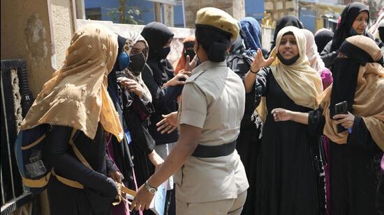 According to Sood, the police struggled to deploy more women reserve police during the recent agitations, particularly the hijab controversy. (AP) According to Sood, the police struggled to deploy more women reserve police during the recent agitations, particularly the hijab controversy. (AP)