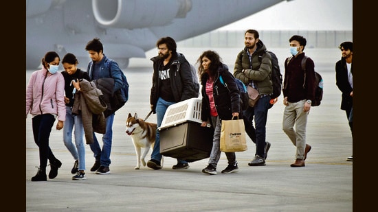 Indian students from Ukraine arrived at the Hindon Air Force Station in Ghaziabad, with their pet pals. (Photo: HT)