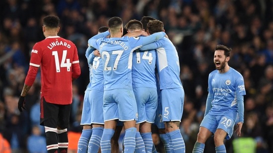 Manchester City celebrate a goal against Manchester United