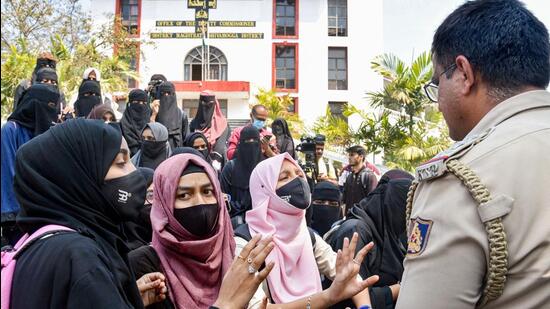 On March 3, college authorities denied permission to the hijab-clad girls to sit for the internal exams based on the Karnataka high court’s interim order and asked them to leave the college premises. (PTI) On March 3, college authorities denied permission to the hijab-clad girls to sit for the internal exams based on the Karnataka high court’s interim order and asked them to leave the college premises. (PTI)