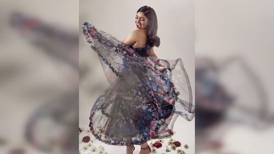 Bhumi Pednekar twirled like a princess with red stilettoes on and a sweet smile on her face. (Instagram/@bhumipednekar)