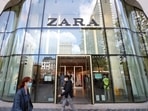A logo of Zara is seen at the entrance of a store.