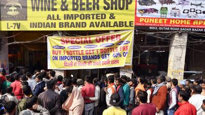 People crowding at a liquor shop after it dropped prices following Delhi Government's new excise policy (ANI) People crowding at a liquor shop after it dropped prices following Delhi Government's new excise policy (ANI)