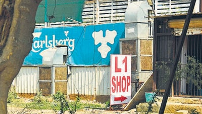 Gurugram , India – March 08, 2022: ‘L1’ signboard seen near a liquor shop in Sector 29, near Leisure Valley Grounds in Gurugram , India, on Tuesday, March 08, 2022. The excise department in a crackdown has removed more than 200 ‘L1’ hoardings outside liquor shops as liquor vendors are directed not to display ‘L1’ hoarding to promote their business. (Photo by Vipin Kumar/ Hindustan Times) (Vipin Kumar/HT PHOTO) Gurugram , India – March 08, 2022: ‘L1’ signboard seen near a liquor shop in Sector 29, near Leisure Valley Grounds in Gurugram , India, on Tuesday, March 08, 2022. The excise department in a crackdown has removed more than 200 ‘L1’ hoardings outside liquor shops as liquor vendors are directed not to display ‘L1’ hoarding to promote their business. (Photo by Vipin Kumar/ Hindustan Times) (Vipin Kumar/HT PHOTO)
