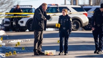 Police investigate a shooting outside East High School in in Des Moines, Iowa. (AP)