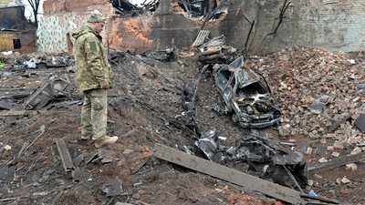A Ukrainian serviceman looks at destructions following a shelling in Ukraine's second-biggest city of Kharkiv. (AFP) A Ukrainian serviceman looks at destructions following a shelling in Ukraine's second-biggest city of Kharkiv. (AFP)
