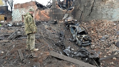 A Ukrainian serviceman looks at destructions following a shelling in Ukraine's second-biggest city of Kharkiv. (AFP) A Ukrainian serviceman looks at destructions following a shelling in Ukraine's second-biggest city of Kharkiv. (AFP)