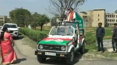 Samajwadi Party candidate from Hastinapur constituency in Meerut district, Yogesh Verma keeps an eye on EVM strong room with binoculars(ANI) Samajwadi Party candidate from Hastinapur constituency in Meerut district, Yogesh Verma keeps an eye on EVM strong room with binoculars(ANI)