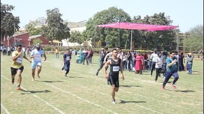 Students participating in a track event at the annual athletics meet at GNDE College, Ludhiana. (HT Photo)