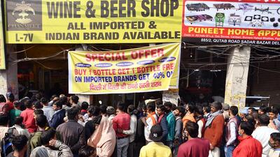 People outside a liquor shop near Delhi’s Sadar Bazar after the reduction in its prices on February 16. (ANI) People outside a liquor shop near Delhi’s Sadar Bazar after the reduction in its prices on February 16. (ANI)