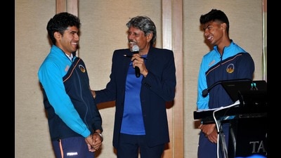 Indian cricket legend Kapil Dev sharing a light moment with Under-19 World Cup stars Rajangad Bawa (left) and Harnoor Pannu (right) in Chandigarh on Tuesday. (Ravi Kumar/HT)