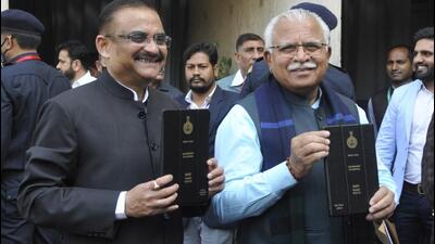 Haryana chief minister Manohar Lal Khattar with additional chief secretary, finance and planning, TVSN Prasad at the Vidhan Sabha in Chandigarh on Tuesday before presenting the state budget for 2022-23. (Keshav Singh/HT) Haryana chief minister Manohar Lal Khattar with additional chief secretary, finance and planning, TVSN Prasad at the Vidhan Sabha in Chandigarh on Tuesday before presenting the state budget for 2022-23. (Keshav Singh/HT)