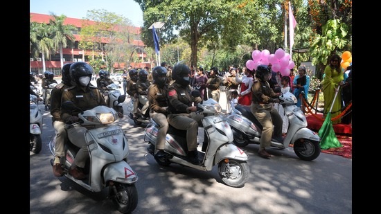 A scooter rally by female police personnel being flagged off at Government College for Girls, Sector 42, Chandigarh, to mark International Women’s Day. (Ravi Kumar/HT)