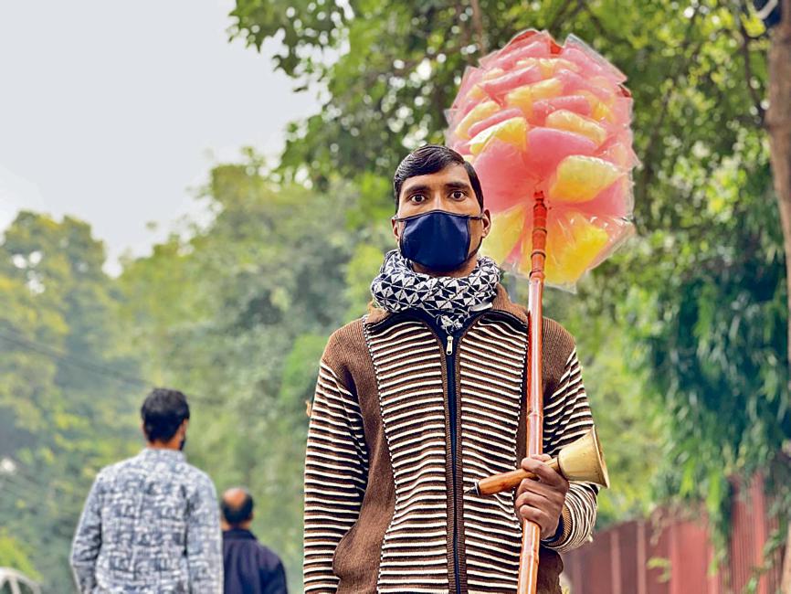 The cotton candy hawker now gets up from the pavement and resumes his walk. The cotton candy hawker now gets up from the pavement and resumes his walk. 