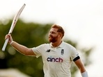 England's Jonny Bairstow celebrates as he walks off the pitch at the end of play.