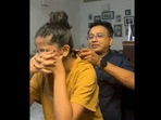 Screengrab from the viral Instagram video that shows singer Unnikrishnan braiding his daughter Uthara’s hair. (instagram/@unnikrishnanpofficial) Screengrab from the viral Instagram video that shows singer Unnikrishnan braiding his daughter Uthara’s hair. (instagram/@unnikrishnanpofficial)