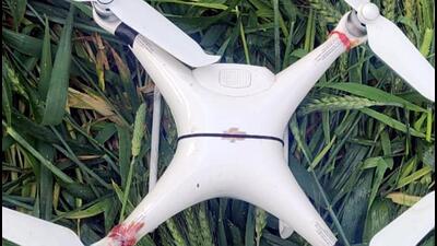 Border Security Force (BSF) troops recover one drone in a wheat field near village Havelian, approximately 1,000 m from the Indo-Pakistan border in Tarn Taran district on Wednesday. (ANI)