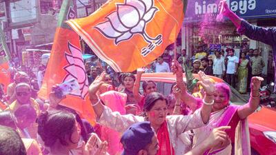 BJP supporters celebrated the party’ landslide victory in Assam municipal board polls with colours. (PTI) BJP supporters celebrated the party’ landslide victory in Assam municipal board polls with colours. (PTI)