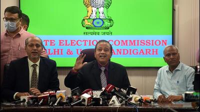 Delhi election commissioner SK Srivatava, secretary Sandeep Mishra and deputy secretary PK Goyal during the press conference at Delhi state commission, Nigam Bhawan, in New Delhi on Wednesday. (Raj K Raj/HT Photo) Delhi election commissioner SK Srivatava, secretary Sandeep Mishra and deputy secretary PK Goyal during the press conference at Delhi state commission, Nigam Bhawan, in New Delhi on Wednesday. (Raj K Raj/HT Photo)