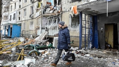 A man leaves an apartment building damaged after shelling the day before in Ukraine's second-biggest city of Kharkiv. (AFP) A man leaves an apartment building damaged after shelling the day before in Ukraine's second-biggest city of Kharkiv. (AFP)