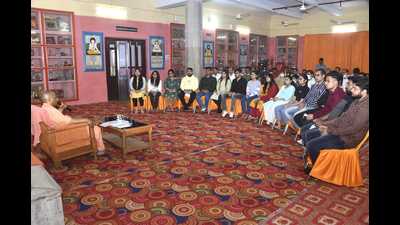 Yogi Aditynath interacting with students from Gorakhpur who returned from Ukraine, in the Tilak Hall of Goraknath temple, Gorakhpur, on Wednesday. (HT Photo) Yogi Aditynath interacting with students from Gorakhpur who returned from Ukraine, in the Tilak Hall of Goraknath temple, Gorakhpur, on Wednesday. (HT Photo)