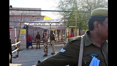 Security personnel stand guard outside the strong room at Ramabai Ambedkar Maidan before a day of counting of Uttar Pradesh Assembly Election, in Lucknow on Wednesday. (ANI Photo)