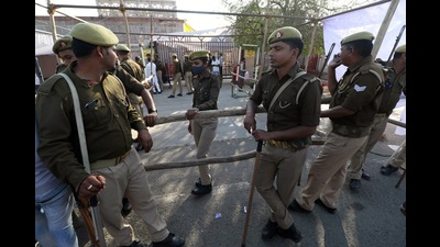 Security personnel stand guard outside the strong room a day before counting of Uttar Pradesh Assembly Election on Wednesday. (ANI Photo) Security personnel stand guard outside the strong room a day before counting of Uttar Pradesh Assembly Election on Wednesday. (ANI Photo)