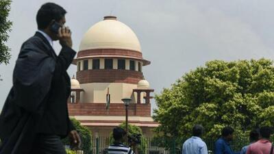 A lawyer outside the Supreme Court of India. (PTI Photo) A lawyer outside the Supreme Court of India. (PTI Photo)