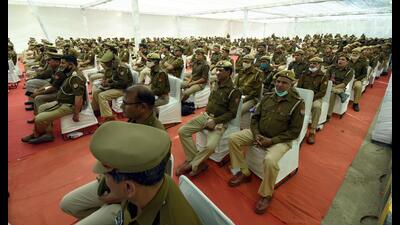 Police personnel attend a meeting on the eve of election results, at the counting centre in Sector 88, Noida, on Wednesday. (Sunil Ghosh /HT)