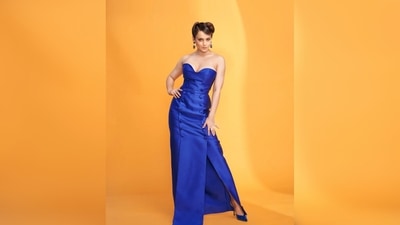 Kangana Ranaut's dress features a long slit that went up till her thighs, a belt around the waist and two lines of buttons. (Instagram/@ziadgermanosworld) Kangana Ranaut's dress features a long slit that went up till her thighs, a belt around the waist and two lines of buttons. (Instagram/@ziadgermanosworld)