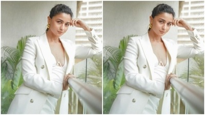 Alia Bhatt picked a white short dress and layered it with a white oversized blazer for the pictures. (Instagram/@aliabhatt)