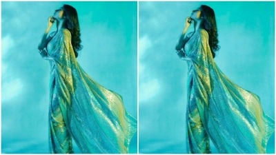 Mouni's green sequined saree came decorated in silver resham threads. She paired it with a green blouse with halterneck details. (Instagram/@imouniroy)