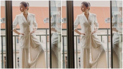 Alia's white attires are a treat for sore eyes. Here's a picture from her trip to Berlinale where she decked up in a white blazer and white satin palazzos. (Instagram/@aliabhatt)