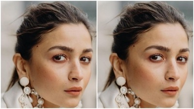In a no makeup look and detailed white earrings, Alia posed like a diva. (Instagram/@aliabhatt)