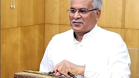 Chhattisgarh chief minister Bhupesh Baghel carries a briefcase made of cow dung to present the state budget in the legislative assembly, in Raipur on Wednesday. (ANI)